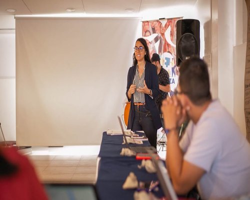 Speaker presenting historical archives at a cultural seminar