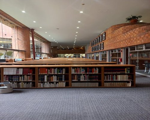 Interior of a modern public library in Peru with wooden tables and natural light